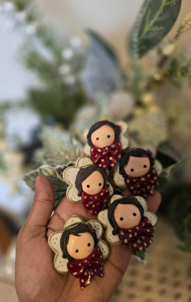 red bow clay angels by Little Flower Ammu Chacko
