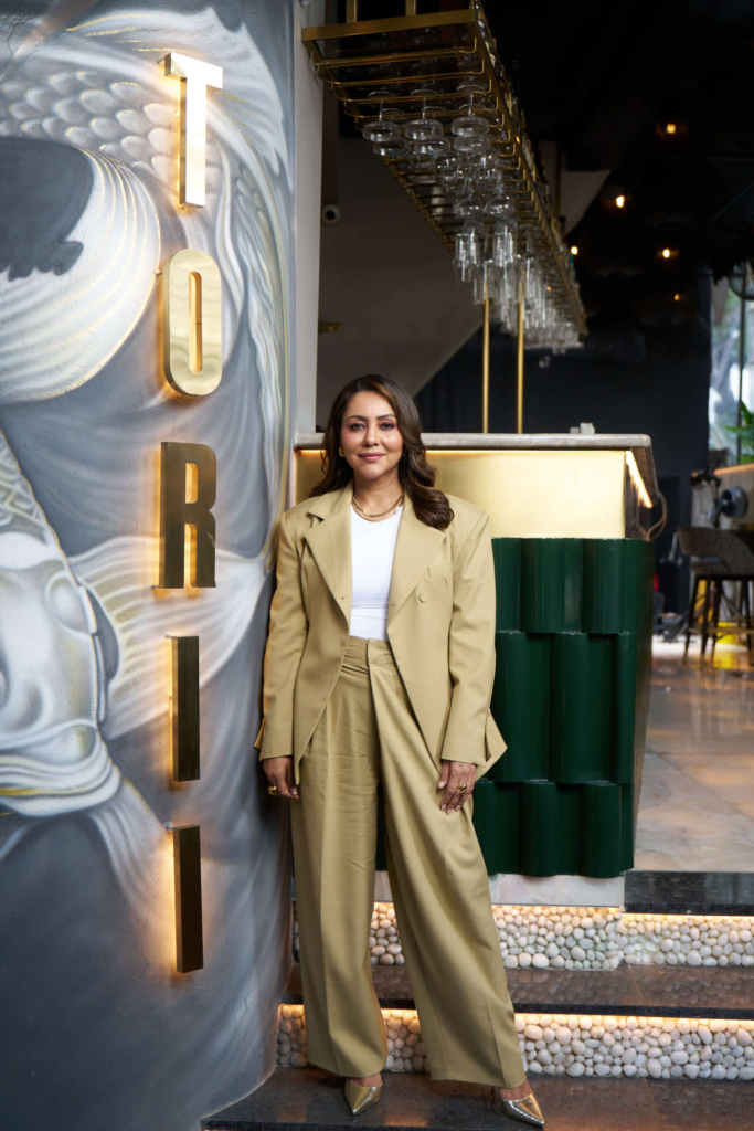 gauri khan infront of her restaurant torii