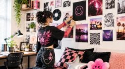 Gen Z decorating a colorful wall with posters in a stylish bedroom.