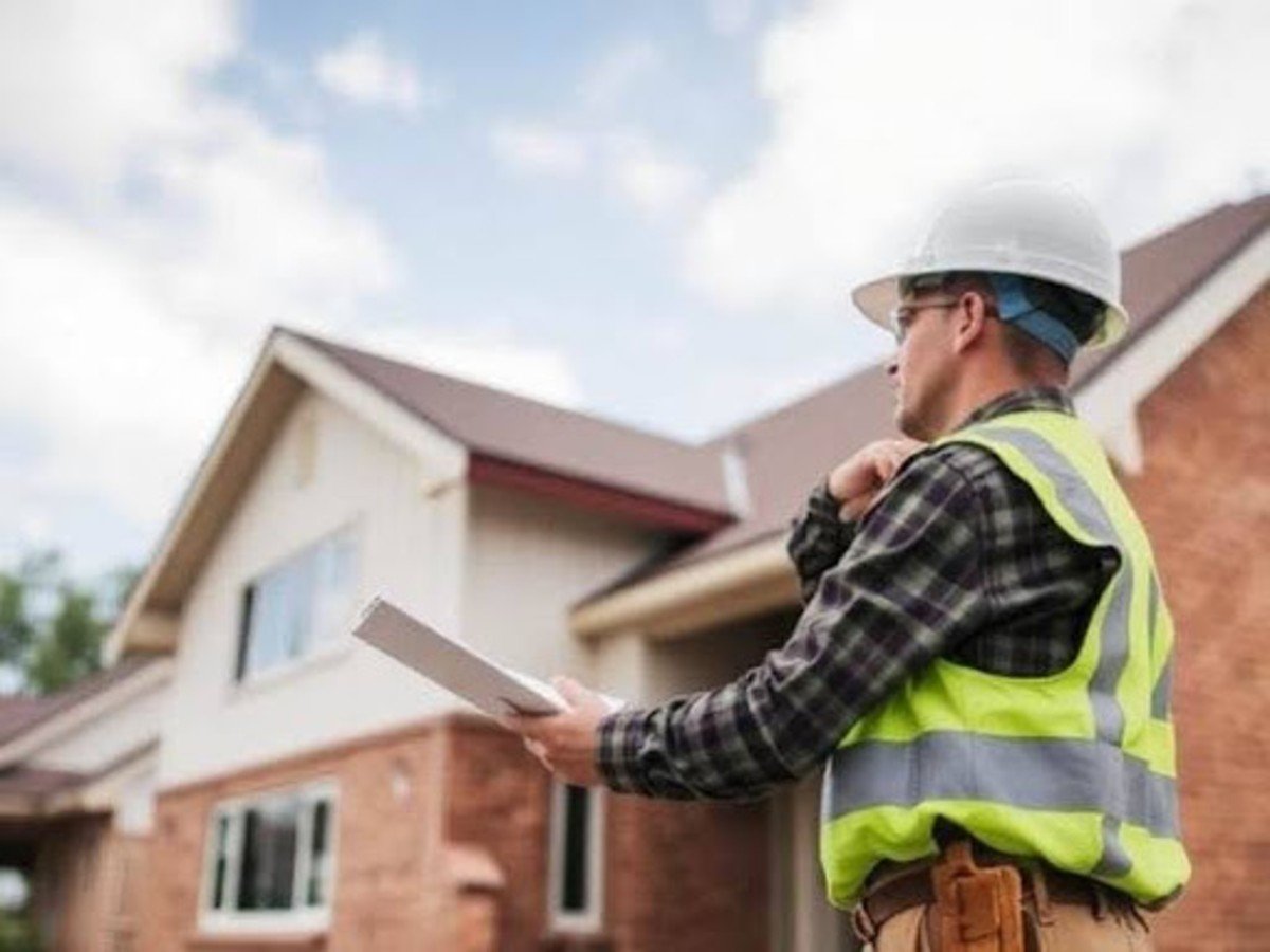 Builder inspecting a custom home
