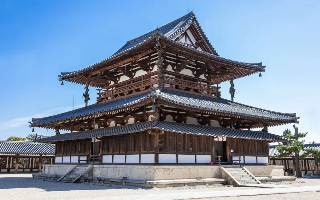 Traditional Japanese temple with layered tiled roofs and wooden architecture.