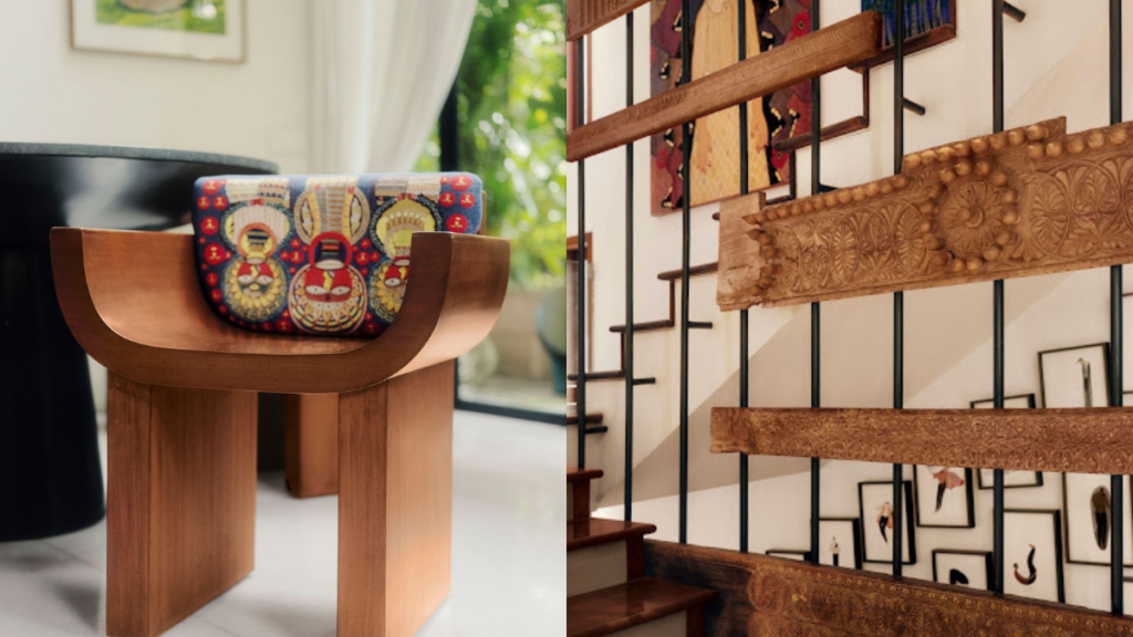 Anamika Khanna-inspired interior featuring a handcrafted wooden table with colorful artwork and carved wooden wall décor.