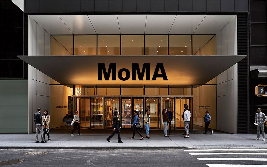 Entrance of the Museum of Modern Art (MoMA) in New York City with visitors outside.